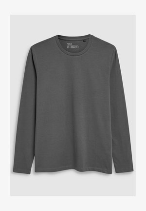 Szürke, hosszúujjú póló sima pamut anyagból, kerek nyakkal és normál szabással, finom varrási részletekkel.