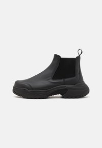 LOW CHELSEA BOOT UNISEX - Platåstövletter - black