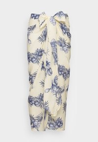 Blomstertrykt omslag i lys gul stof med marineblå blomster og blade, bundet om taljen med en sløjfe. Blød tekstur, løs pasform.
