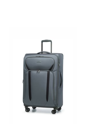 Valise grise à roulettes avec une poignée rétractable, poches latérales, accents noirs, texture lisse et quatre roues multidirectionnelles pour une maniabilité aisée.