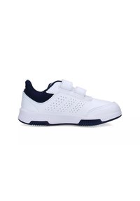 White athletic shoe with navy accent, featuring two Velcro straps, perforated design for breathability, rubber sole, and rounded toe.