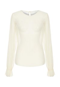 Biały prążkowany sweter z długimi, przezroczystymi rękawami, okrągłym dekoltem i zapięciem na guziki z tyłu. Z delikatnymi postrzępionymi mankietami.