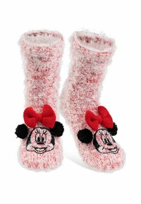 Calzini pelosi rossi e bianchi con un design di Minnie Mouse, dotati di un viso ricamato, un fiocco rosso e pompon neri su ciascun lato.
