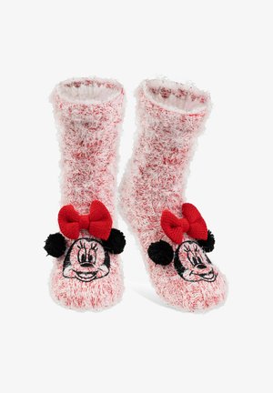 Calzini pelosi rossi e bianchi con un design di Minnie Mouse, dotati di un viso ricamato, un fiocco rosso e pompon neri su ciascun lato.