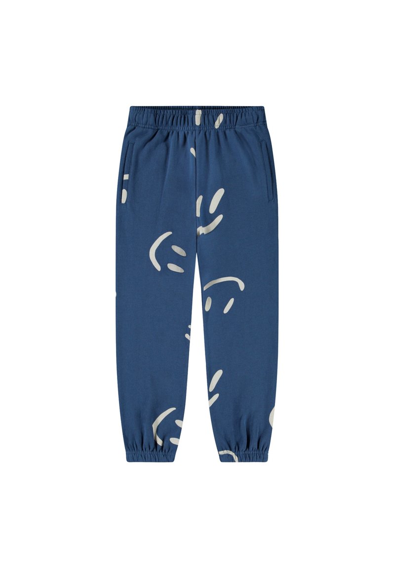 Blauwe katoenen joggingbroeken met elastische tailleband, voorzien van abstracte witte smiley-ontwerpen en zijzakken. Elastische boorden bij de enkels.