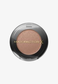 Pressed eyeshadow in a circular compact. Color: light rose gold with a shimmery texture. Features a clear lid and gold lettering.