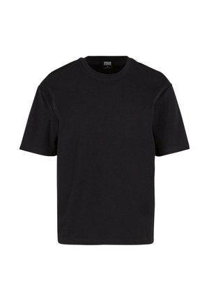 T-shirt nero a maniche corte realizzato in morbido cotone. Ha un classico collo a giro e una vestibilità rilassata, senza motivi visibili o dettagli metallici.