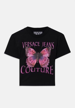 Black cotton t-shirt featuring a large pink butterfly graphic with purple accents and the text "VERSACE JEANS COUTURE" in bold, glittery letters.