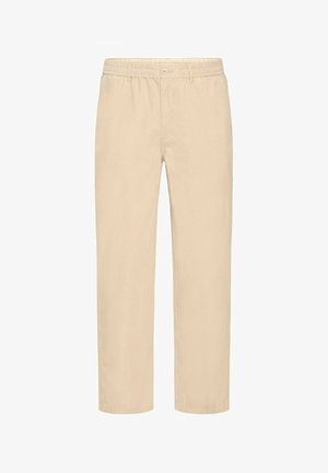 Bežistest puuvillased püksid sirge jala disainiga, elastse vöökoha ja esise nööpklõpsuga. Sile tekstuur ja minimaalne detailide hulk.