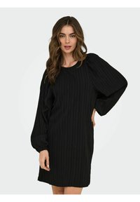 Black dress with textured vertical stripes, round neckline, and puff sleeves; knee-length design, made from lightweight fabric.