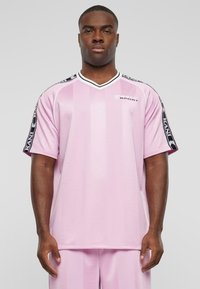 Pink sports jersey with vertical stripes, short sleeves, V-neck, and contrasting black accents on the shoulders. Fabrics appear smooth.