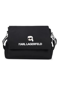 Geantă de umăr neagră din nylon, cu închidere cu clapetă, având un logo de desen animat și text alb contrastant. Curea reglabilă cu accente marcate.