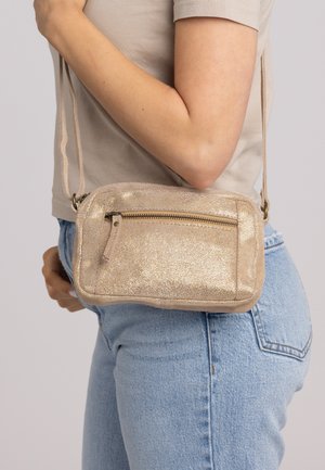 DOMINIC - Cross body bag - gold