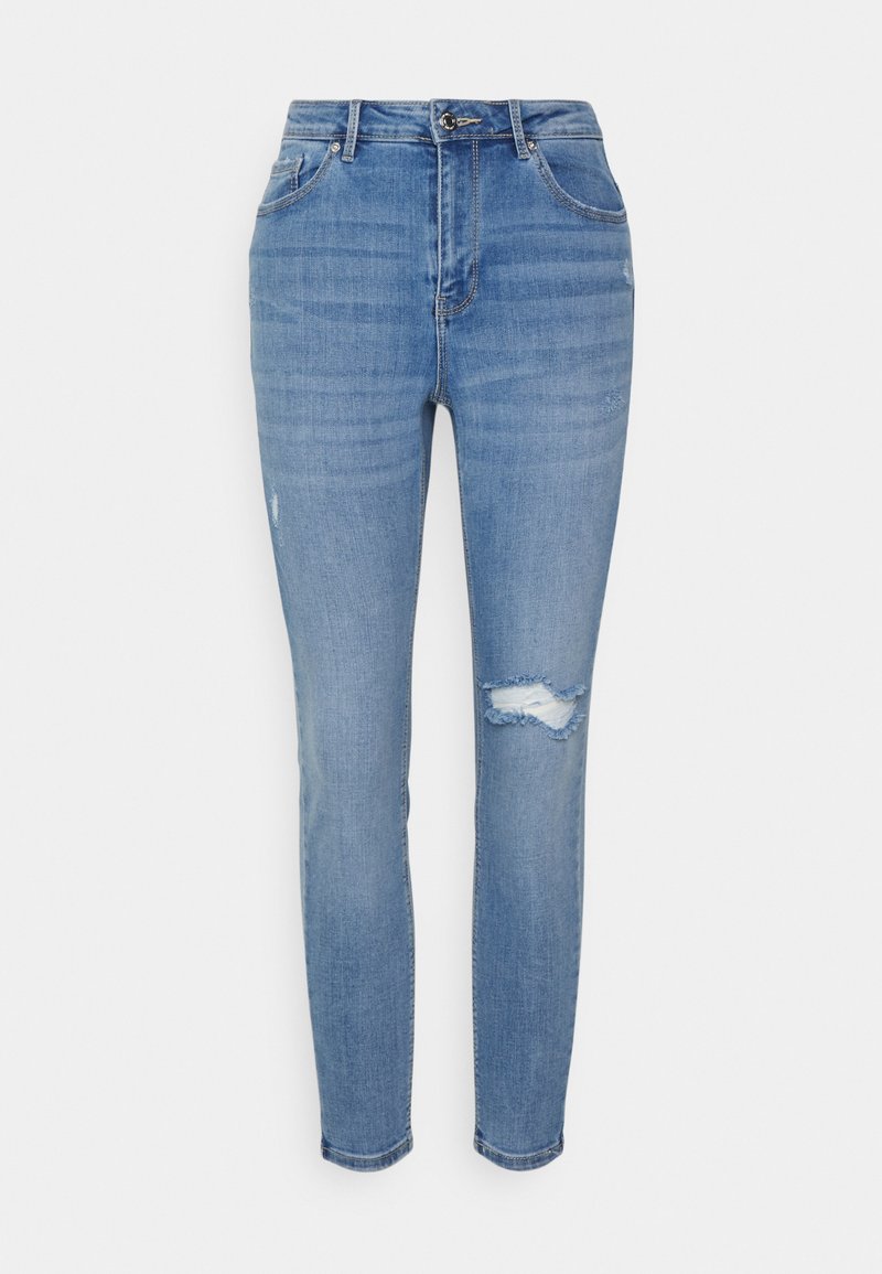 Jeans de ganga azul claro com corte slim, apresentando uma cintura de altura média, desvios subtis e um detalhe de joelho desgastado. Design clássico de cinco bolsos.