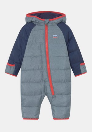 Padded snowsuit in grey with navy sleeves, red accents, and a hood. Features a front zipper and elastic cuffs for added warmth.