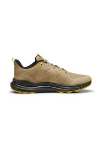 Beige athletic shoes with a mesh upper, textured surface, yellow accents, and a black collar. Features a cushioned, black outsole.