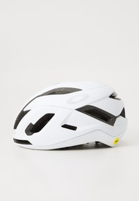 White cycling helmet with aerodynamic design, multiple ventilation openings, and a textured surface; features MIPS technology and side accents.