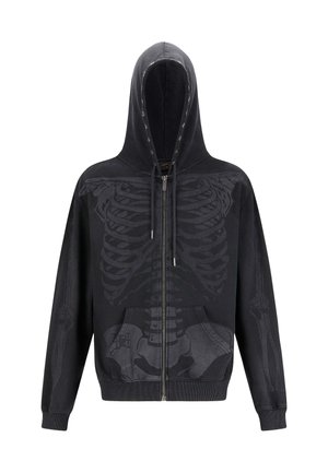 Zwarte zip-up hoodie met een gedetailleerde skeletafdruk op de voorkant. Het heeft een capuchon, voorzakken en een elastische zoom.