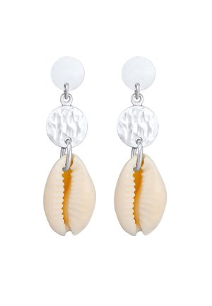 Silver-tone earrings with hammered round discs and natural cowrie shells hanging beneath each disc.