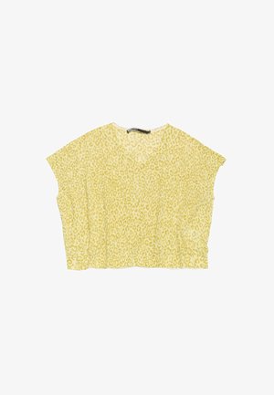 Haut jaune à manches courtes avec un motif léopard, en tissu léger, et un décolleté en V avec une coupe ample.