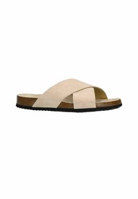 Beige suede cross-strap slide sandal with a cork-wrapped midsole and black rubber outsole. Flat design for casual wear.