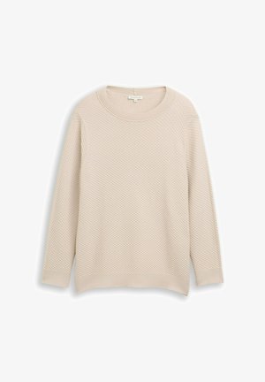 Svetlo bež pulover z teksturirano, satovje podobno vzorcem. Ima širok okrogli izrez in dolge rokave, z rebrastim robom.