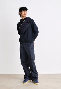 K-Way - EXCLUSIVE UNISEX - Cargo trousers - blue depht Thumbnail Image 1