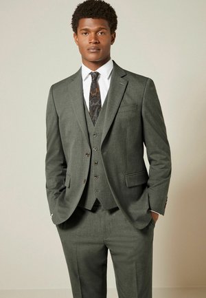 Gray three-piece suit with a textured fabric, featuring a single-breasted jacket, vest, and patterned tie. Tailored fit and complimentary shirt.