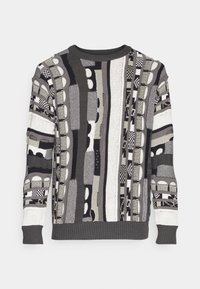 Sweter dzianinowy z geometrycznym wzorem w kolorach czarnym, białym i szarym. Okrągły dekolt, długie rękawy oraz ściągacze przy mankietach i u dołu.