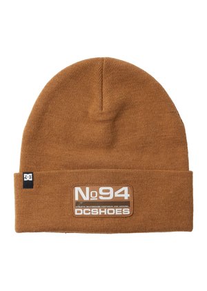 Brown knit beanie hat featuring a fold-over cuff and a branded patch with "No. 94" and "DCSHOES." Textured ribbed design.