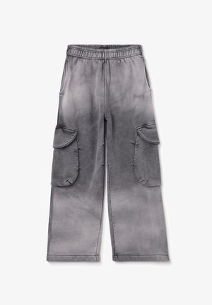 Cargo pants in gray gradient, featuring an elastic waistband, two large side pockets, and soft, textured fabric. Notable brand logo on front.