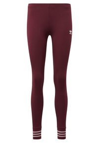 Burgundy leggings av stretchigt tyg, med en åtsittande design och kontrasterande vita ränder vid ankeln samt en liten logotyp på det övre benet.