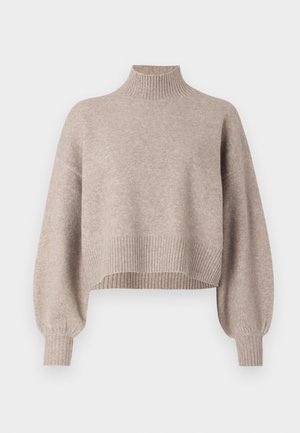 Pull court beige clair avec un col montant, des poignets et un ourlet côtelés. Texture douce et coupe ample avec des manches légèrement bouffantes.