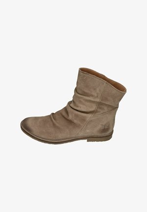 Brown suede ankle boot with slouched design, rounded toe, and flat sole. Notable stitching detail at the base and logo accent on the side.