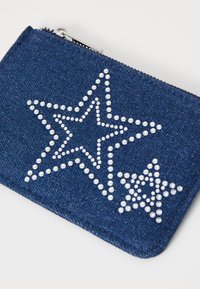 Denim zip wallet in navy, featuring two star designs accented with small silver studs. Smooth texture with a clean, rectangular shape.