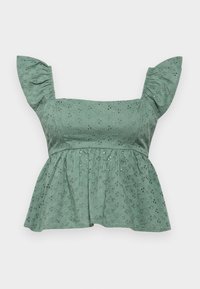 Top peplum de algodón verde con mangas abullonadas, que presenta patrones de ojales florales y un acabado texturizado. El dobladillo acampanado añade volumen.