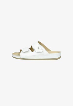 Sandale blanche en matériau synthétique avec deux sangles réglables à velcro. Elle dispose d'une semelle beige et de coutures minimales.