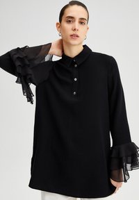 Touché Privé FRILLY ARMED  - Tunika - black