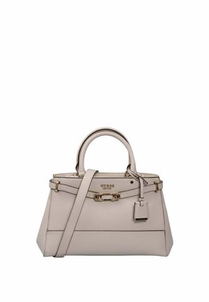 Sac à main structuré beige clair avec double anses supérieures, bandoulière ajustable, détail boucle à l'avant et logo GUESS en métal doré.