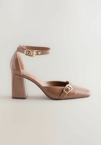 Brown patent leather high heel shoe with a square toe, ankle strap, and gold buckle detail. Textured block heel and smooth finish.