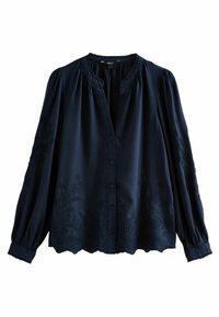 Blusa blu navy con maniche lunghe, chiusura a bottoni, scollatura arricciata e motivi floreali in rilievo lungo l'orlo e le maniche. Tessuto morbido.