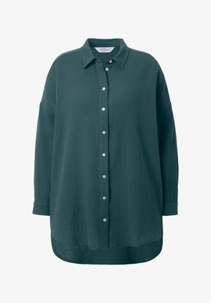 Overdimensioneret mørkegrøn skjorte med knapper, lavet af tekstureret stof, med krave, lange ærmer og synlige hvide knapper foran.