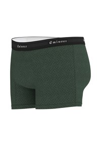Boxer-briefs vert foncé avec un motif géométrique texturé, comportant une taille noire avec le logo "Eminence" et une doublure intérieure blanche.