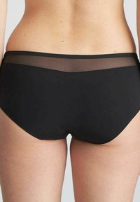 Colorato nero, slip realizzati in un tessuto liscio con una fascia in rete trasparente, che offrono un design senza cuciture e una vestibilità comoda.