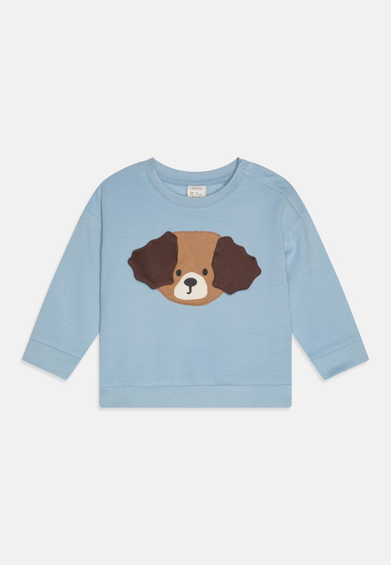 Light blue long-sleeve sweatshirt featuring a brown and tan appliqué dog face design on the front. Soft cotton material with ribbed cuffs.