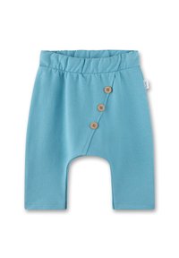 Light blue cotton shorts with an elastic waistband, featuring a diagonal button closure with three wooden buttons on the front.