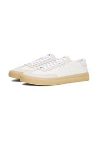 White leather sneakers with beige suede accents, rounded toe, and cream rubber sole. Features white laces and branding on the side.