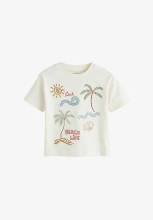 White short-sleeve t-shirt with colorful embroidered sun, waves, two palm trees, seashell, and "Beach Life" and "Le Soleil" text.