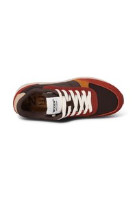 Brown and red sneaker with mesh upper, suede accents, white laces, and logo tag. Features a cushioned insole and rubber sole.
