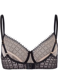 Musta pitsinen bralette, jossa on läpinäkyvät paneelit, geometriset kuvioinnit, säädettävät hihnat ja kultasävyinen solki. Herkkä reunus reunoilla.